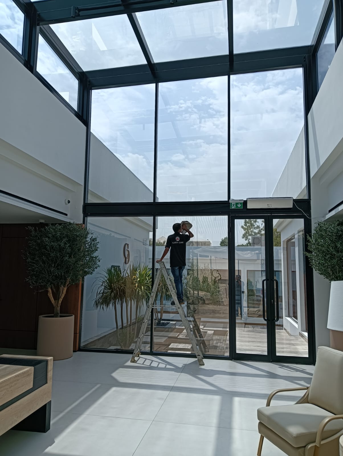 Safety Gard window film installation on school campus UAE &mdash; certified technician